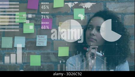 Presenting manager pointing at brick wall with notes in meeting room, projecting charts, copy space Stock Photo