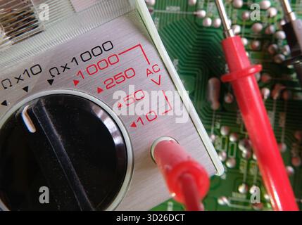 Testing and test instruments in electronics. Focused on AC Voltage section on the voltmeter. Stock Photo