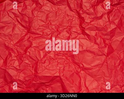 Crumpled and Textured Red Paper Background Stock Photo