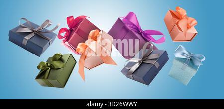 Gift boxes flying in air on blue gradient background Stock Photo