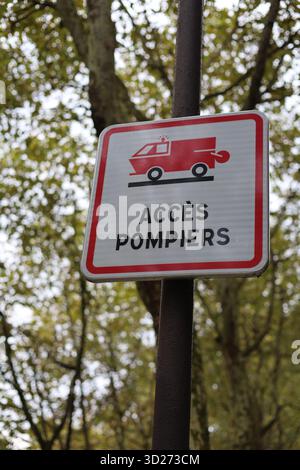 Access for firefighters road sign in French Access Pompiers vertical photo Stock Photo