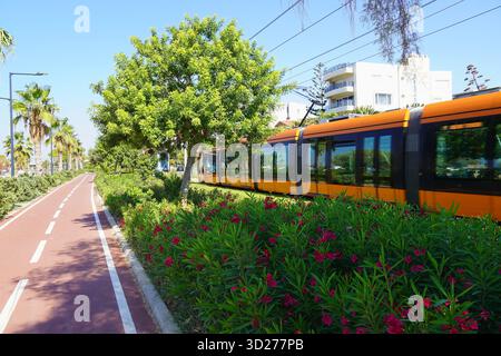 The two lane cycle path and a tram, on the sea shore of Glyfada, Athens, Greece Stock Photo