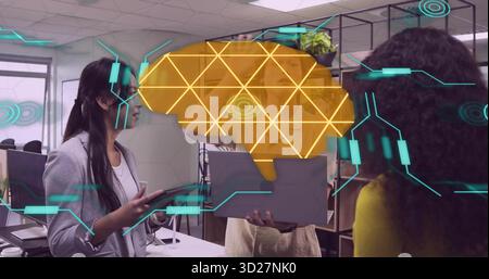 Collaborating three professionals studying AR brain graphic in open-plan office with laptop tablet Stock Photo