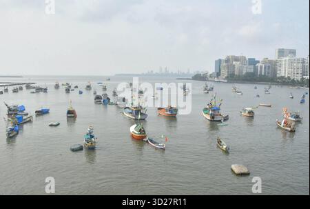 MUMBAI, INDIA - OCTOBER 30: Fishing boats anchored at Badhwar Park Jetty after the Indian Meteorological Department IMD has issued a weather alert on October 30, 2025 in Mumbai, India. Water transport services and fishing in sea operation have been suspended due to bad weather and rain forecast as a precautionary measure following forecasts of gusty winds and potential thunderstorms linked to the impact of Cyclone Montha. Photo by Bhushan Koyande/Hindustan Times Fishing Operations Suspended In Mumbai As IMD Issued Precautionary Alert Due To Impact Of Cyclone Montha Stock Photo
