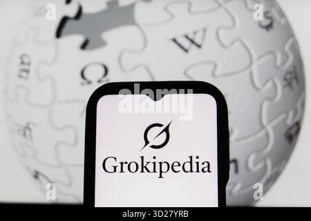 Bandung, West Java, Indonesia. 31st Oct, 2025. In this photo illustration, Grokipedia logo is displayed on a smartphone with Wikipedia logo in the background. (Credit Image: © Algi Febri Sugita/ZUMA Press Wire) EDITORIAL USAGE ONLY! Not for Commercial USAGE! Stock Photo