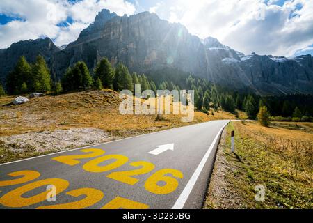 2026 New Year road trip travel and future vision concept . Nature landscape with highway road leading forward to happy new year celebration in the beg Stock Photo
