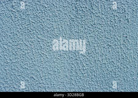 Blue relief, rough, blue plaster. decorative stucco wall with abstract vintage texture and grunge aesthetic. Stock Photo