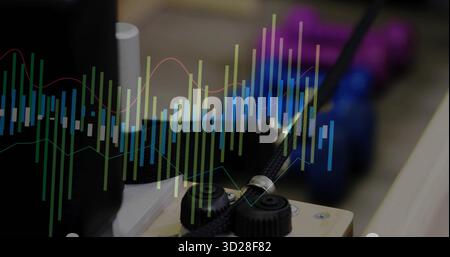 Displaying control module showing knobs and data overlay on wooden workbench, with braided cable Stock Photo
