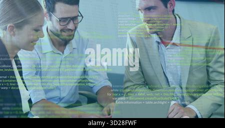 Three developers in business casual reviewing code in office, with laptop and code projection Stock Photo
