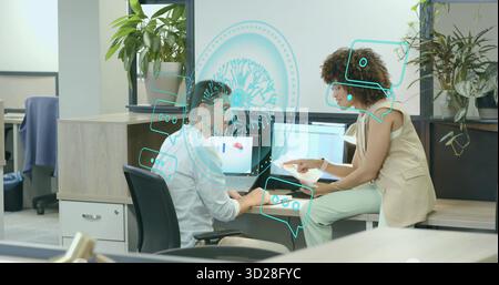 Colleagues reviewing reports and analyzing laptop charts in modern office, using holographic data Stock Photo