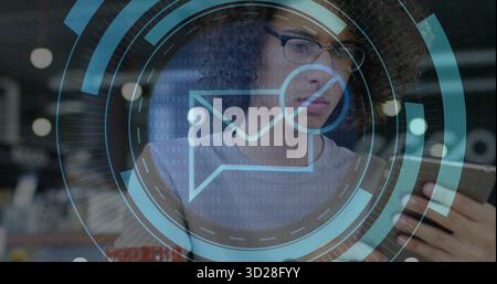 Tech man wearing grey sweater focusing on smartphone in office, with envelope and binary overlays Stock Photo