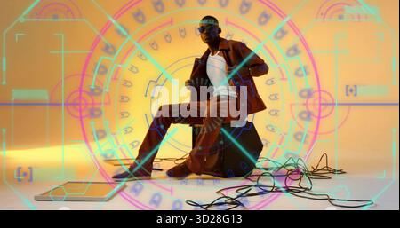 Showing midadult man wearing brown suit and sunglasses playing accordion in studio with audio cable Stock Photo