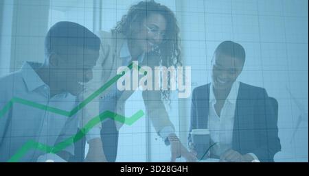 Smiling professionals pointing documents and holding coffee cup under graph overlay in meeting room Stock Photo