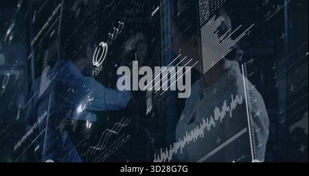 Accessing cables in server racks in data center, engineers in business shirts viewing AR overlay Stock Photo