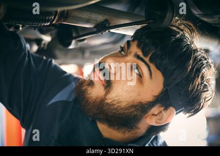 Close-up of a mechanic repairing a car Stock Photo