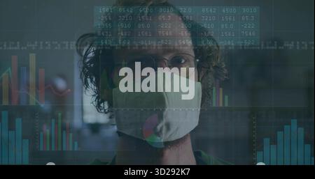 Gazing man wearing fabric face mask and round glasses in blurred office, with digital overlays Stock Photo