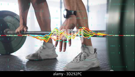 Positioning man's hands under loaded barbell on gym floor, with smartwatch sneakers and data lines Stock Photo