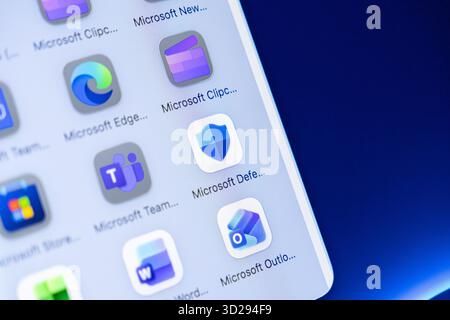 Poznan, Poland - October 16, 2025: Mobile screen displaying Microsoft Edge, Defender, Teams, and Outlook apps, supporting digital work and modern cybe Stock Photo