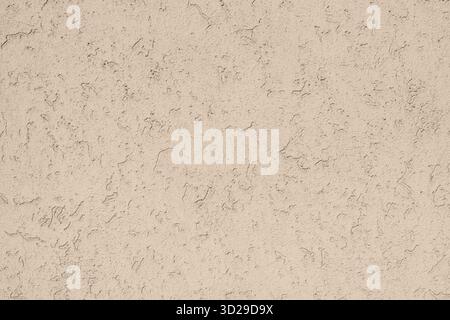 Beige stucco textured wall surface background Stock Photo