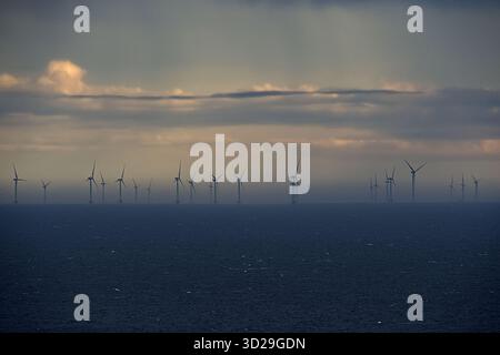 Wind Turbines on the horizon during the blue hour. Moray, The North East of Scotland UK Stock Photo