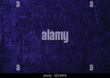 Abstract background of velvet texture of factory fabric in dark blue. The trendy color of the year. lay for design. A copy space. saturation of color Stock Photo