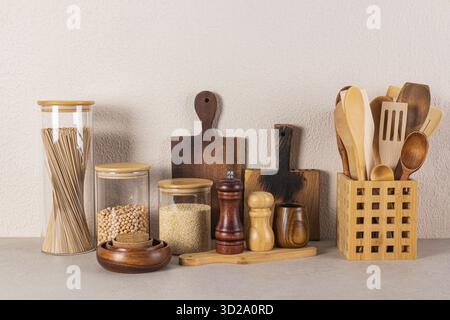 Bamboo Lid Glass Jar Set, Cutting Boards, Kitchen Countertop Wooden Cooking Tools Set. Eco style. Front view Stock Photo