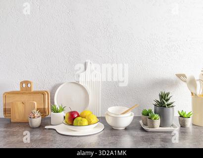 Beautiful kitchen background with a set of various environmentally friendly dishes, cutting boards, fruits in a bowl. space for text Stock Photo