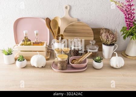 Various kitchen utensils on the kitchen countertop and modern kitchen. front view. the concept of home kitchen decor Stock Photo