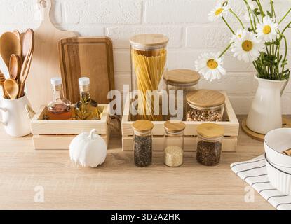 A set of different jars, containers for wounding spices and bulk products in a modern kitchen. front view of the countertop. zero waste Stock Photo