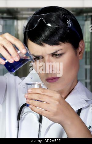 Research scientist testing specimen in laboratory Stock Photo