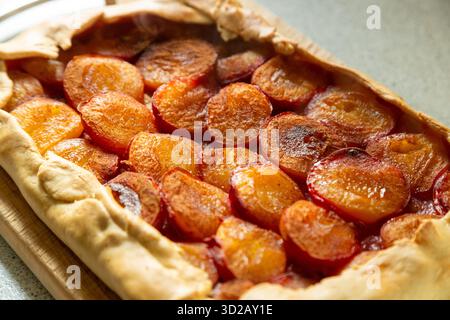 Close up of a homemade shortcrust pastry plum tart Stock Photo