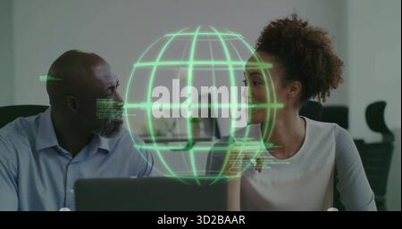 Collaborating professionals working on project at modern office desk, laptops, holographic globe Stock Photo