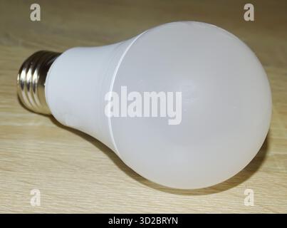 Led light bulb isolated on a wooden background Stock Photo
