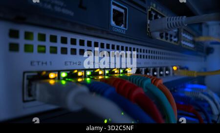 Close-up video of blinking LEDs on network switch showing data flow and connection activity, perfect for IT, technology, and data concepts Stock Photo