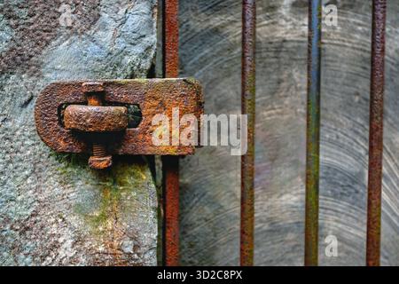 Heavily rusted latch on gate Stock Photo