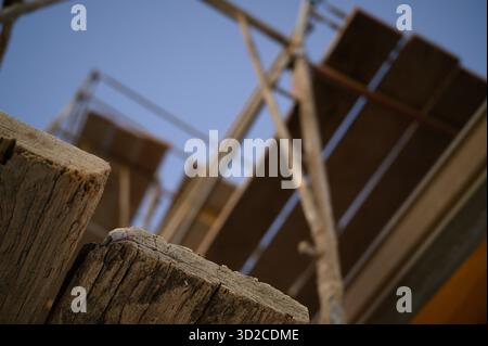 Residential development of single family homes under construction with wooden framing, truss and beam architecture Stock Photo