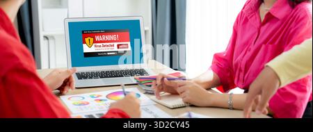 Virus warning alert on computer screen detected brisk cyber threat , hacker, computer virus and malware Stock Photo