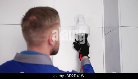 CCTV Expert Installs Security Camera System, Protecting Your Home Stock Photo