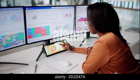 Remote Data Analyst Optimizing Efficiency With Heatmap Software At Office Stock Photo