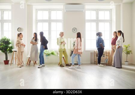 Diverse Team Of Women Talking During Business Meeting In Office Stock Photo