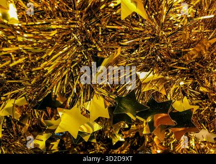 Gold Tinsel Christmas Stars Decoration Metallic Festive Background Shiny Holiday Ornament Abstract Texture Sparkle New Year Celebration Party Stock Photo