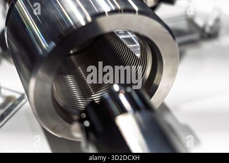 Thread finishing on a CNC machine. Thread burnishing machine, internal thread finishing. Stock Photo