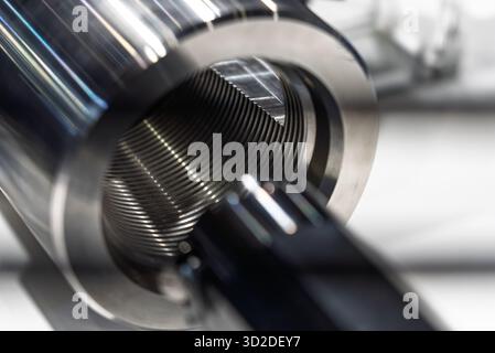 Thread finishing on a CNC machine. Thread burnishing machine, internal thread finishing. Stock Photo
