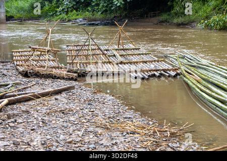 selective focus bamboo raft on the river in the forest Stock Photo