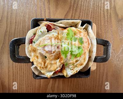 Spanish Eggs Breakfast on griddle pan Stock Photo