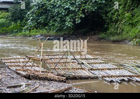 selective focus bamboo raft on the river in the forest Stock Photo