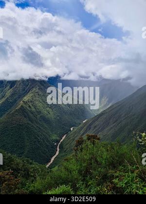 Aerial view of the Urubamba River winding through a deep, lush green ...