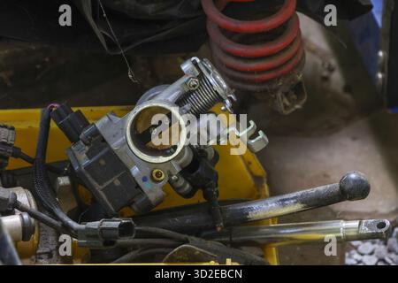 The replacement throttle body on the intake manifold of the engine ...
