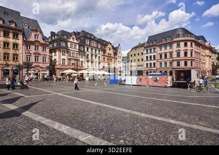 Square made of paving stones and marble slabs with pattern, row of houses, reconstructed historic buildings, outdoor area of a restaurant, lantern, pe Stock Photo