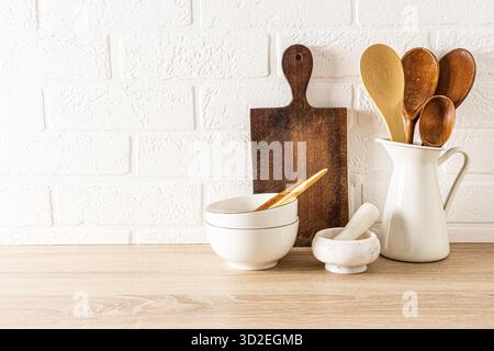 Kitchen background for the layout with a copy of the space on a white brick wall. minimalist composition of part of the kitchen countertop Stock Photo
